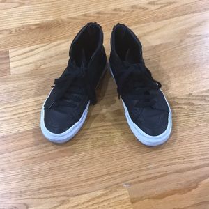 Van’s hightop black leather sneaker with back zip.